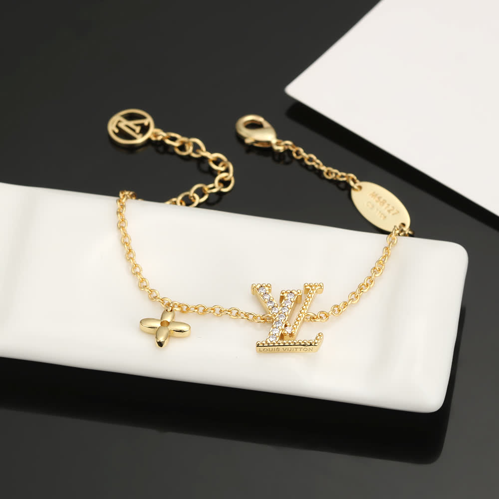 Louis Vuitton Gold Tone Bracelet with Monogram Charm